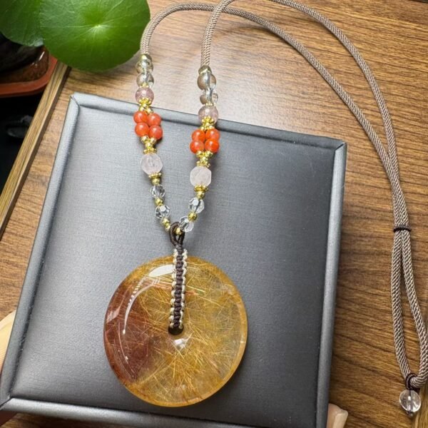 Natural Rutilated Quartz Donut Pendant on a Hand-Braided cord – 37.7 × 9 mm